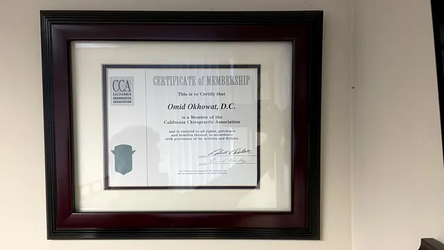 California Chiropractic Association membership certificate on the office wall