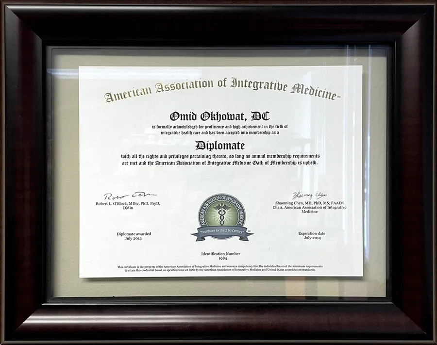 Framed Diplomate certificate from the American Association of Integrative Medicine for Omid Okhowat, DC