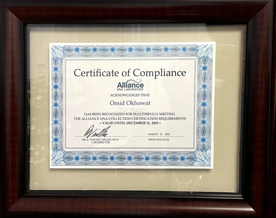 Framed Alliance DNA Laboratory Certificate of Compliance acknowledging Omid Okhowat