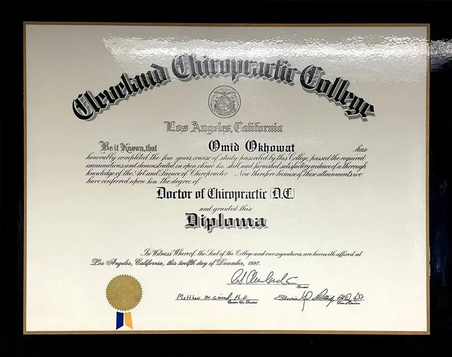 Framed Doctor of Chiropractic diploma from Cleveland Chiropractic College, Los Angeles, awarded to Omid Okhowat